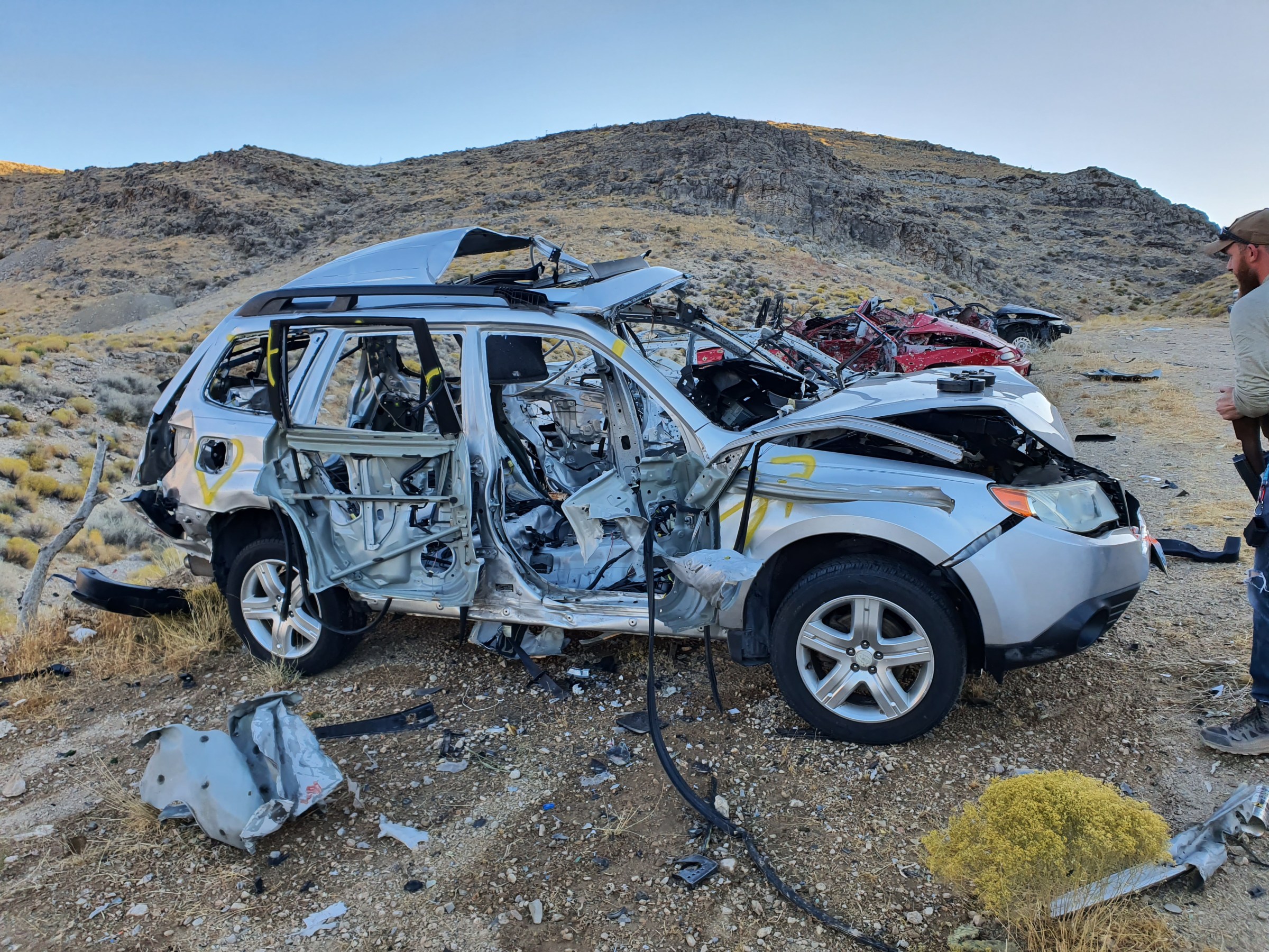 a car parked on the side of a dirt field